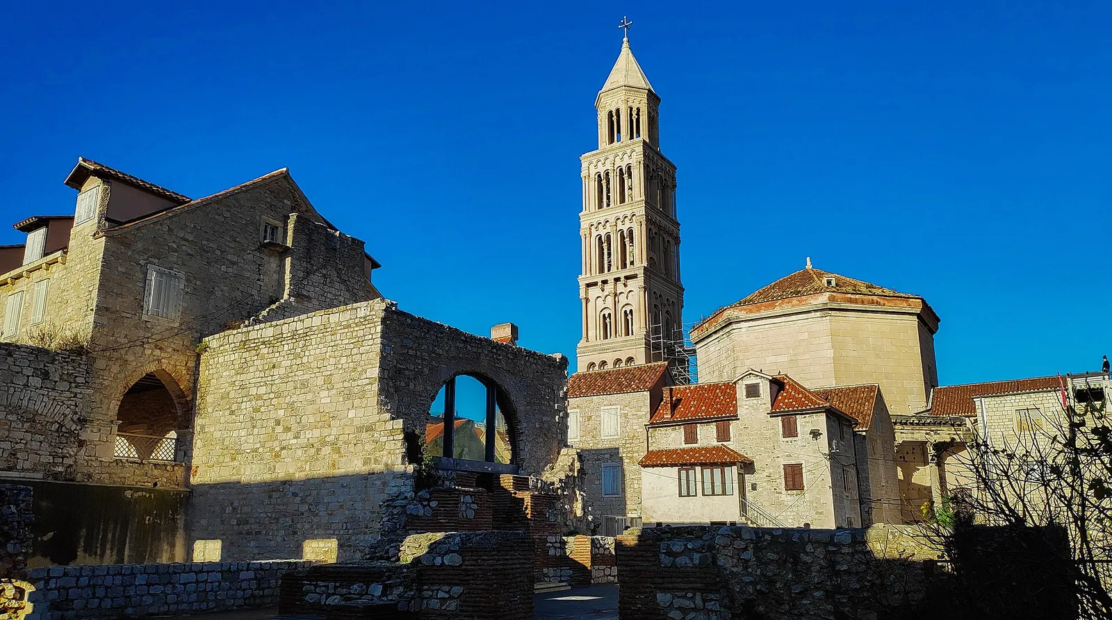 Old town stone houses below the cathedral bell tower