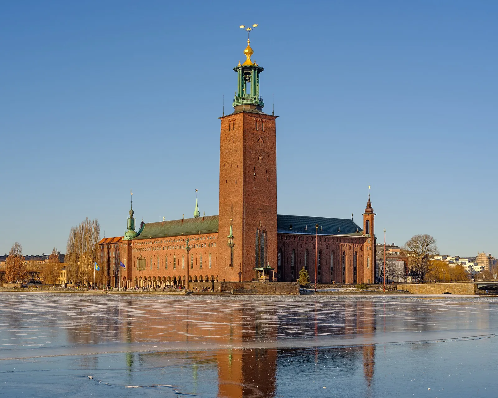 Stockholm City Hall reflected in the water on a bright day