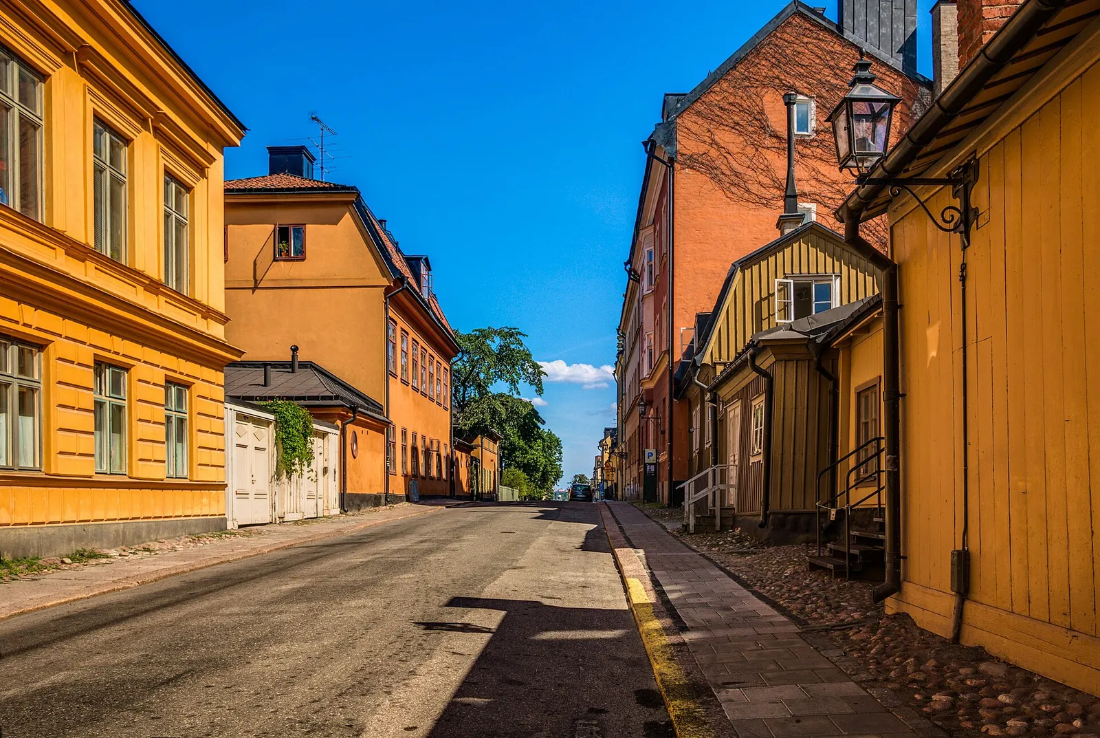 Old painted houses on sunny Fjällgatan, Södermalm