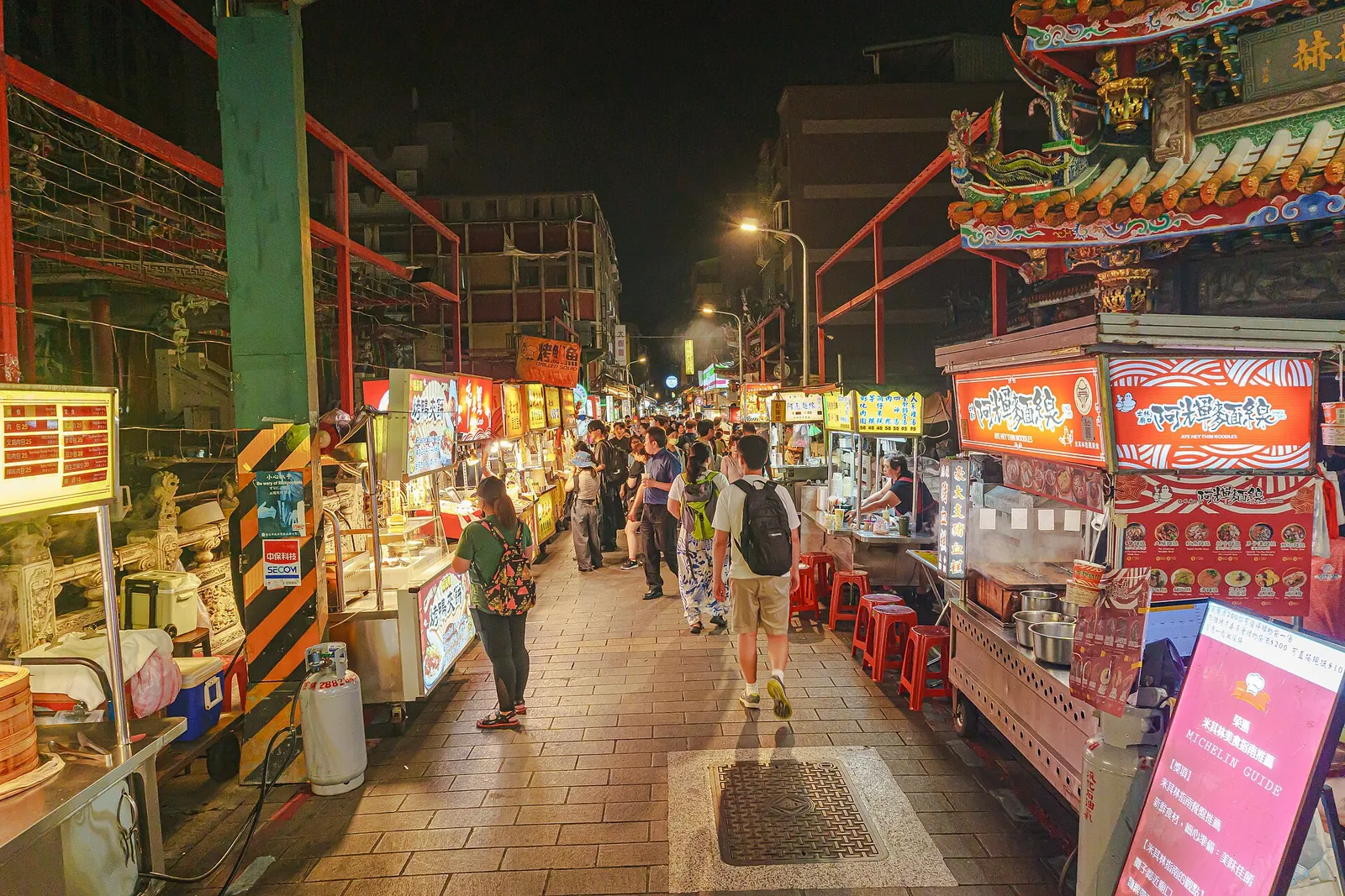 Shilin Night Market stalls lit up after dark