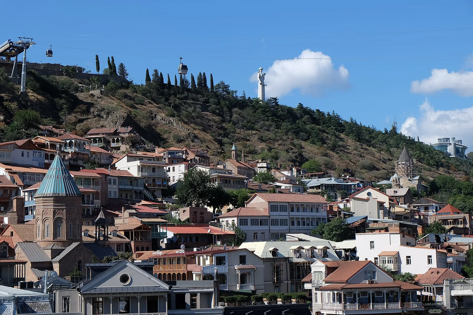 Old Town rooftops below the Mother of Georgia statue and cable car