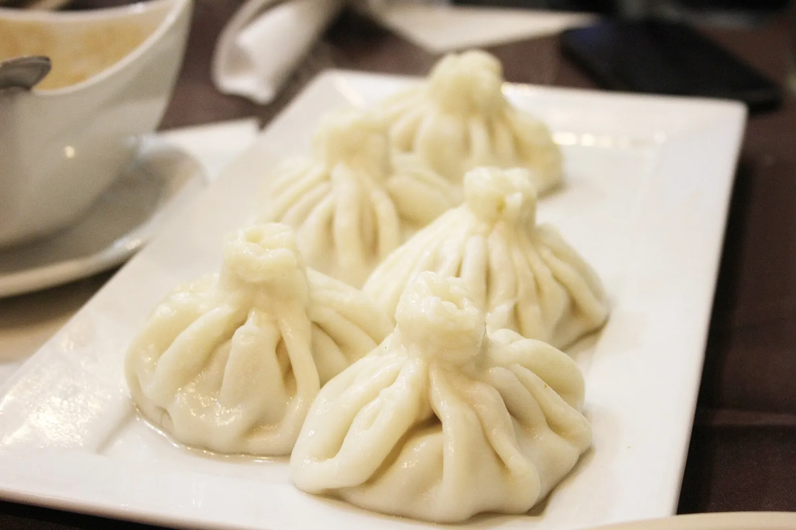 A plate of plump Georgian khinkali dumplings