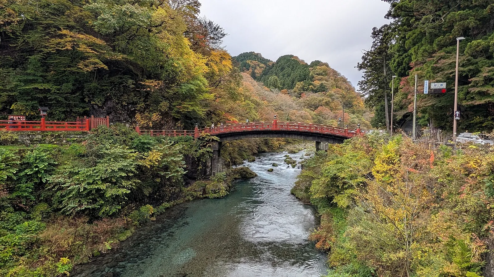 Vermilion Shinkyo Bridge over the Daiya River in autumn