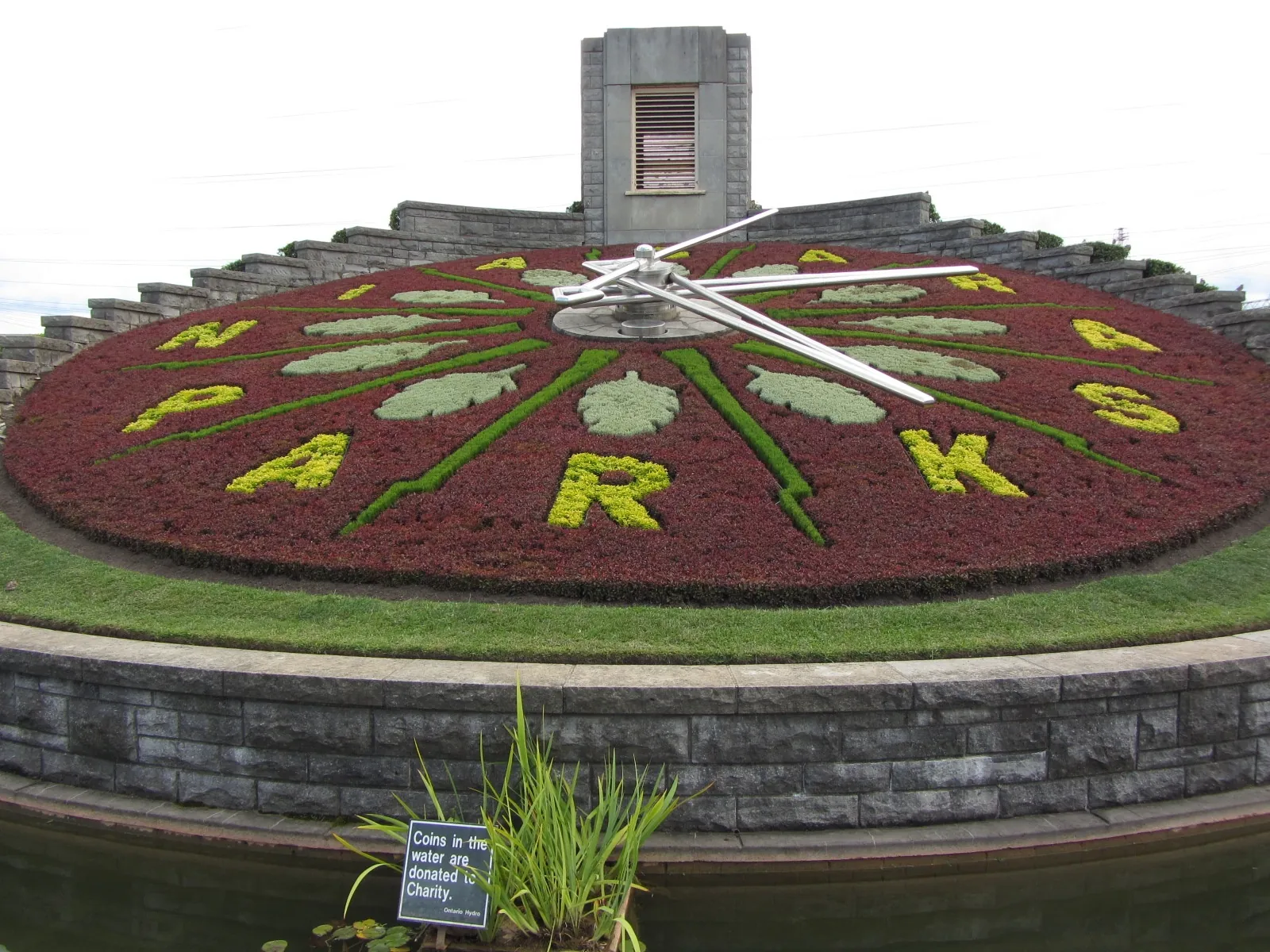 The colourful Floral Clock beside its lily pond