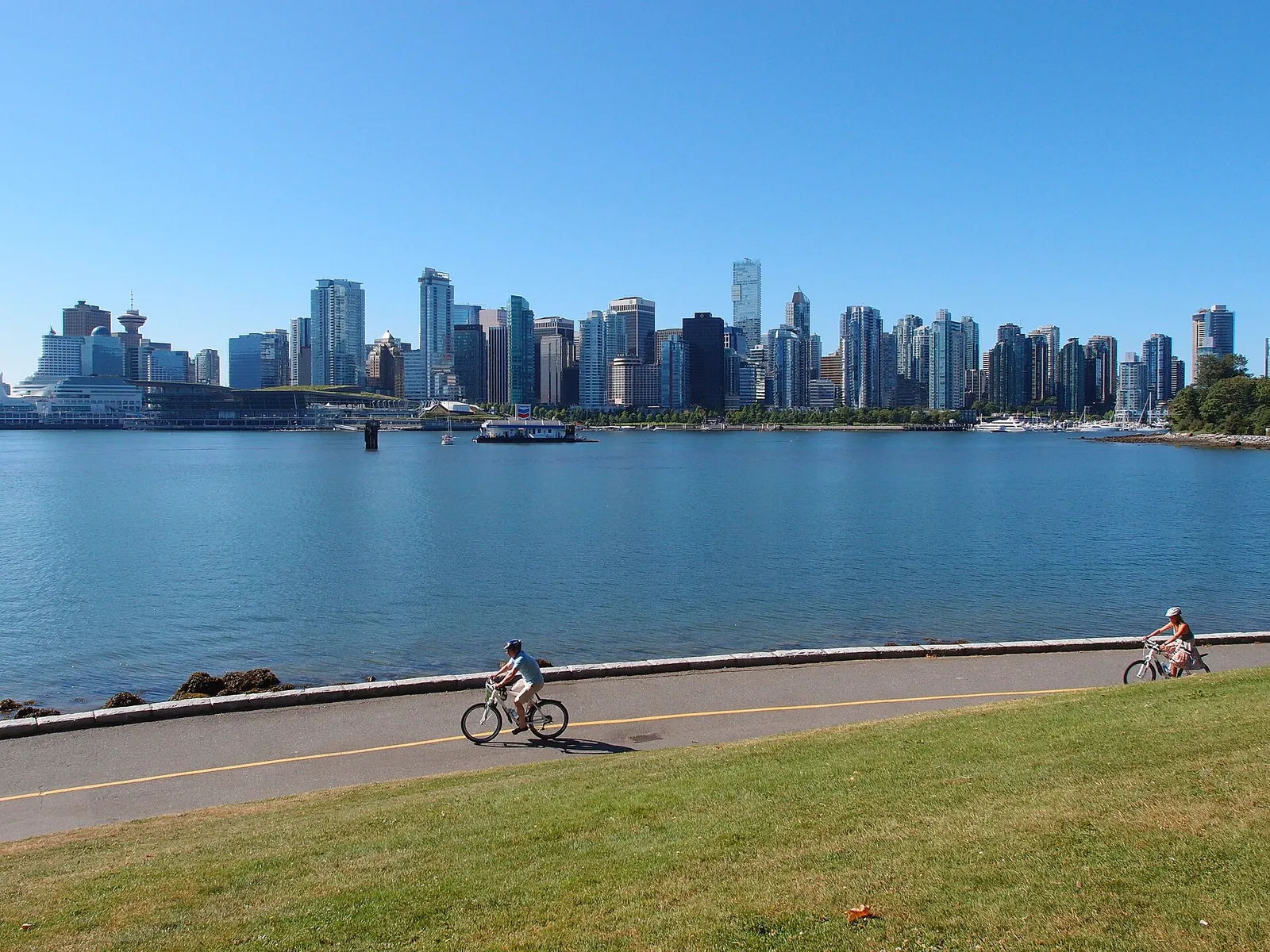 Cycling the Stanley Park Seawall with the skyline across the water