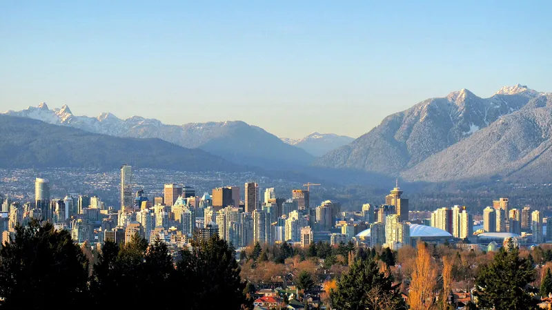 Downtown Vancouver beneath the snowy North Shore mountains