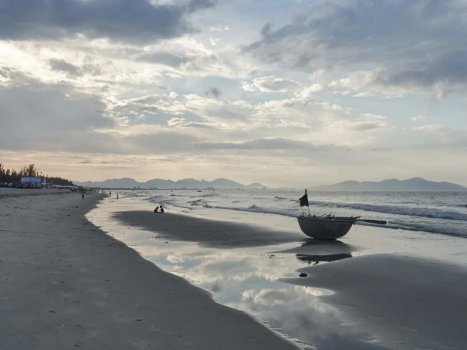 A basket boat in the shallows at An Bang Beach