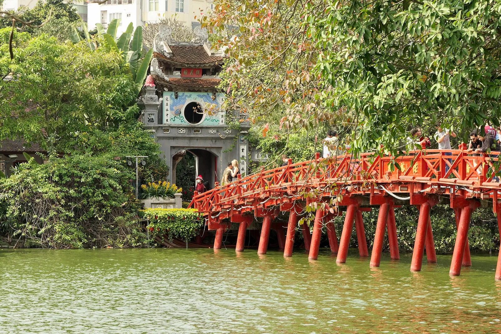 The red Huc Bridge over Hoan Kiem Lake in Hanoi