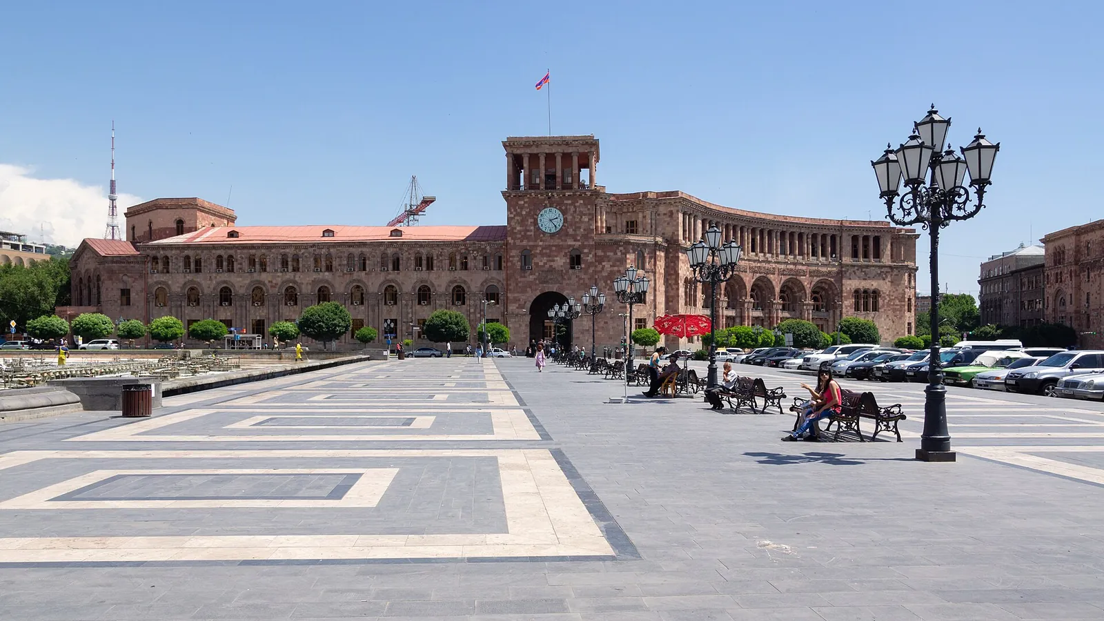 Pink-stone Government House on sunny Republic Square